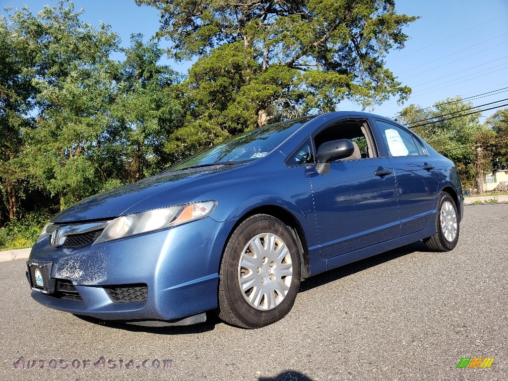 Atomic Blue Metallic / Gray Honda Civic DX-VP Sedan